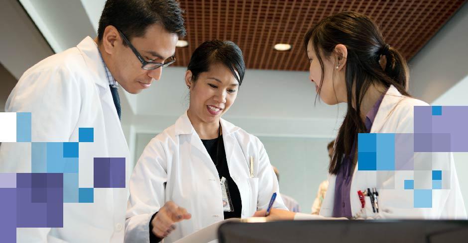 faculty and student pharmacists in white lab coats