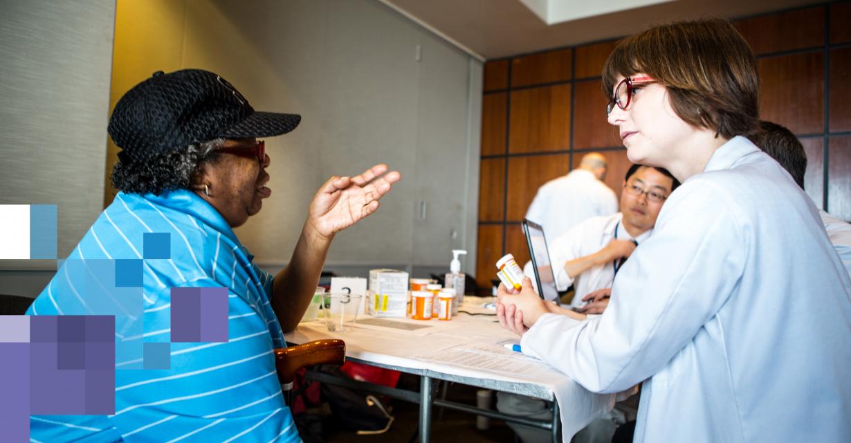 pharmacist and patient discuss the patient's medications