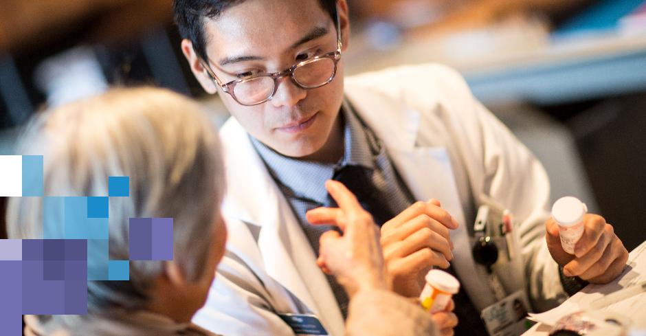 pharmacist and patient discuss the patient's medications