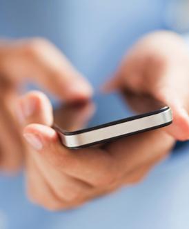 closeup of hands holding cellphone