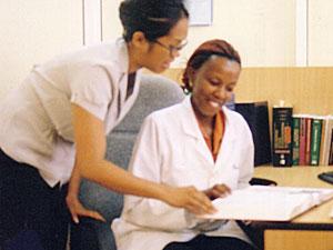 Jennifer Cocohoba with Ugandan clinician