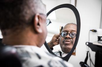 Dixon views himself in the mirror
