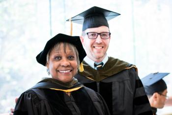Youmans and Houghtaling dressed in regalia