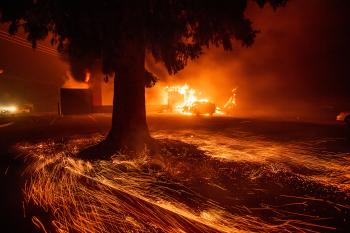 Embers, smoke, and burning car and building