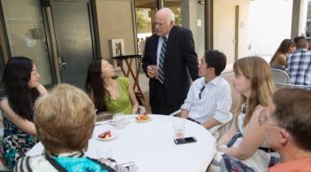 Adler and pharmacy graduates at party