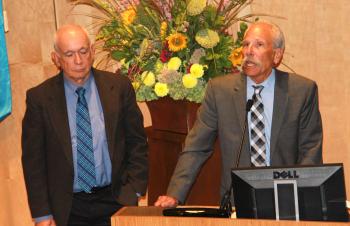 Kearney and Guglielmo at lectern.