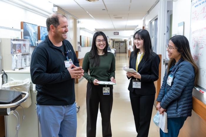Pharmacist talks to pharmacy students and residents