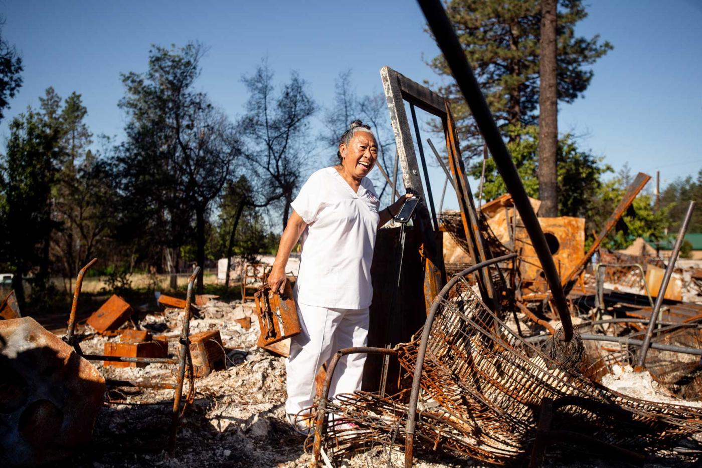 Balbutin stands in burned ruins