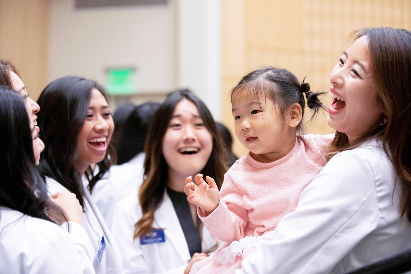 Jung with daughter and onlookers.